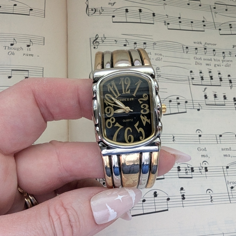 Silvertonw and Goldtone Bangle Watch